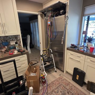 Panel-ready built-in refrigerator with vacuum pump and gauges
