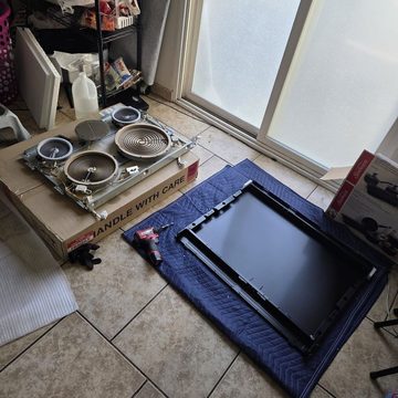 Electric cooktop elements exposed during on-site repair